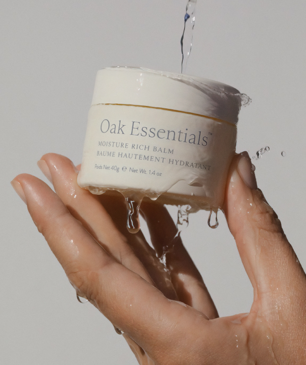 Hand holding Moisture Rich Balm